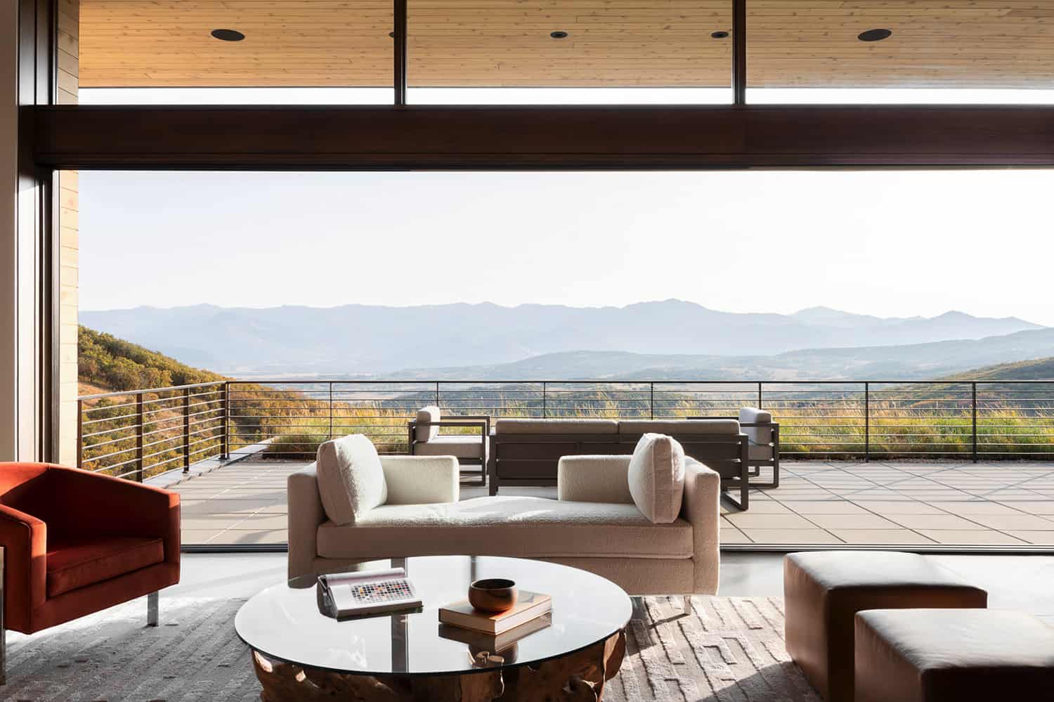 A modern architectural home with clean horizontal lines and floor-to-ceiling glass